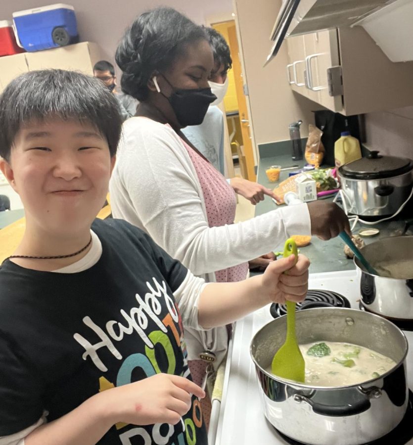 Nancy Byun participates in a cooking activity along with other students.