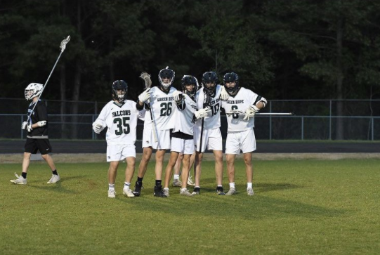 The Mens Lacrosse team shows their spirit and togetherness on the field.