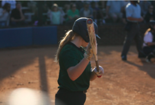 Reagan Morris up at bat. Read more about her perspective as Captain of the Softball team.