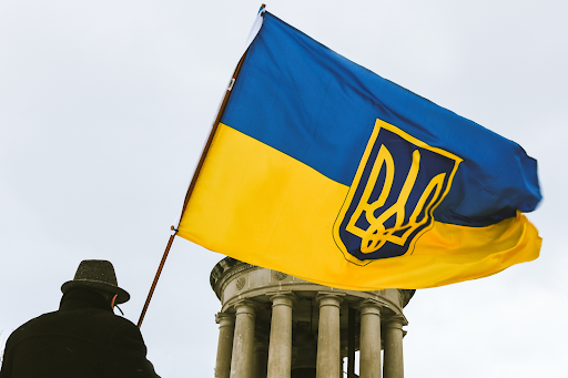 The Ukraine flag depicted with the coat of arms displayed in the center.