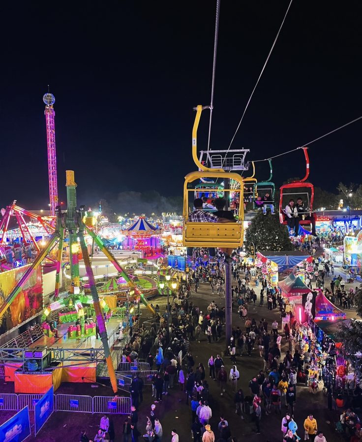 The lift offers views of multicolor lights across the entire fair.