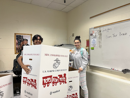 Members of the Black Falcons prepare to distribute donation boxes. 