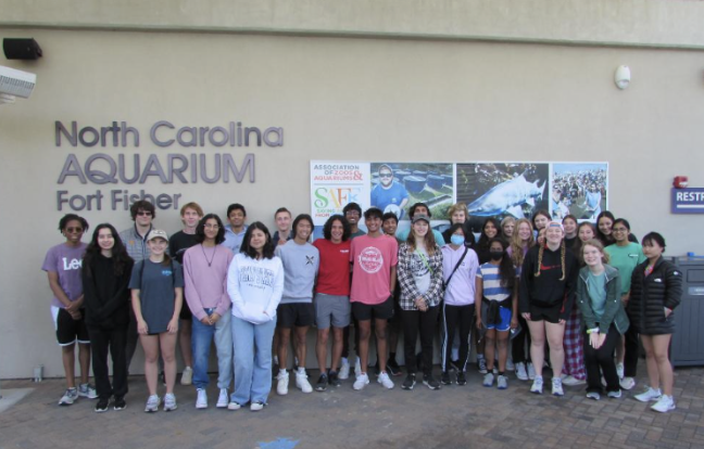 The Marine Ecology students pose outside the North Carolina Aquarium at Fort Fisher, where they had a behind-the-scenes tour.