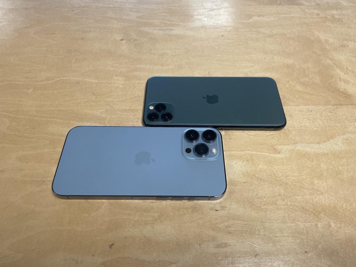 These+two+iPhones+are+nearly+impossible+to+tell+apart.+The+one+on+the+top+is+the+iPhone+13+pro+and+the+one+on+the+bottom+is+the+iPhone+14+pro.+This+fact+that+there+is+so+little+difference+in+iPhones+shows+how+little+the+iPhones+changed+from+one+generation+to+the+next.+