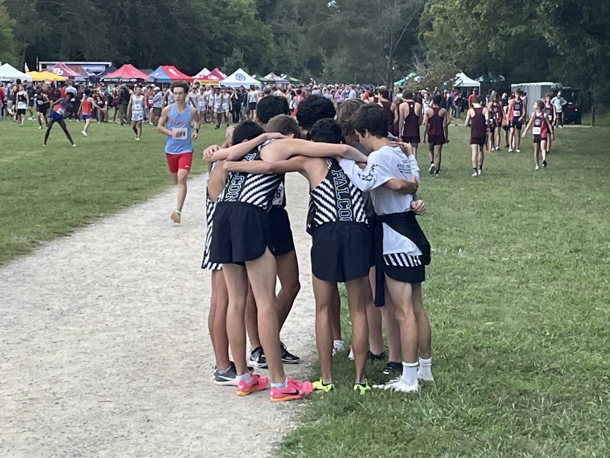 The Cross Country varsity team preparing for the championship race in the Hare and Hounds Invitational. 