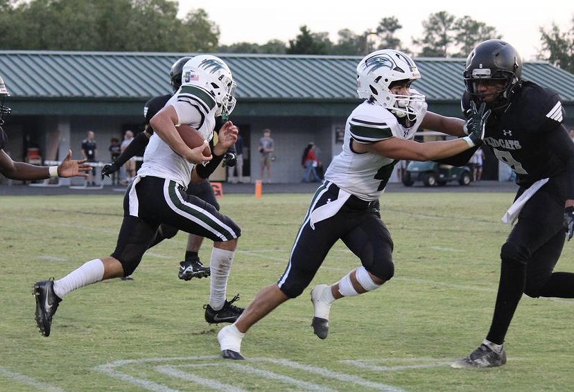 The Green Hope Varsity football team going up against East Chapel Hill resulting in a dominant win.
