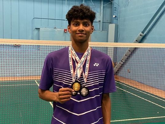 Currently ranked #17 nationally, Siva Rajesh poses with various medals won at a badminton tournaments.