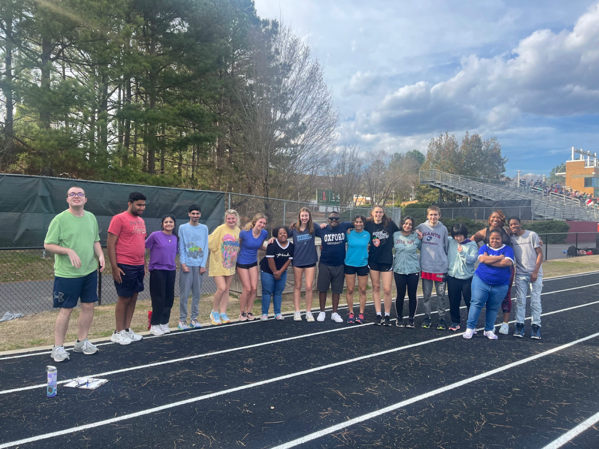 The first practice of the season means meeting new friends! The ‘22-’23 Unified Track team gets together for a group photo. 
