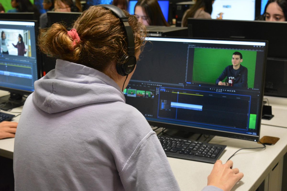 Film class students meticulously edit the multi-camera footage of the anchors to ensure that all clips are up to par for Fridays recording.
