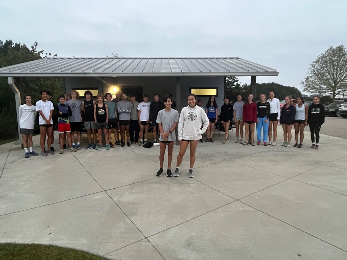 Rafael Dlott (‘27) and Olivia Percival-Shim (‘27 stand in front of the supportive cross country team during a joint boy and girl weekend practice. Photo used with permission from Julie Ross.