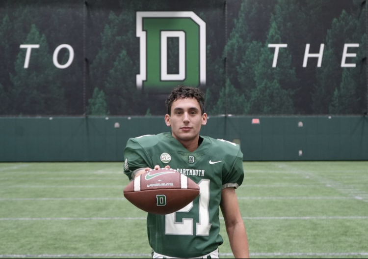 Owen Zalc poses in a Dartmouth uniform, the team that he kicked the game winning field goal for in an overtime thriller.
