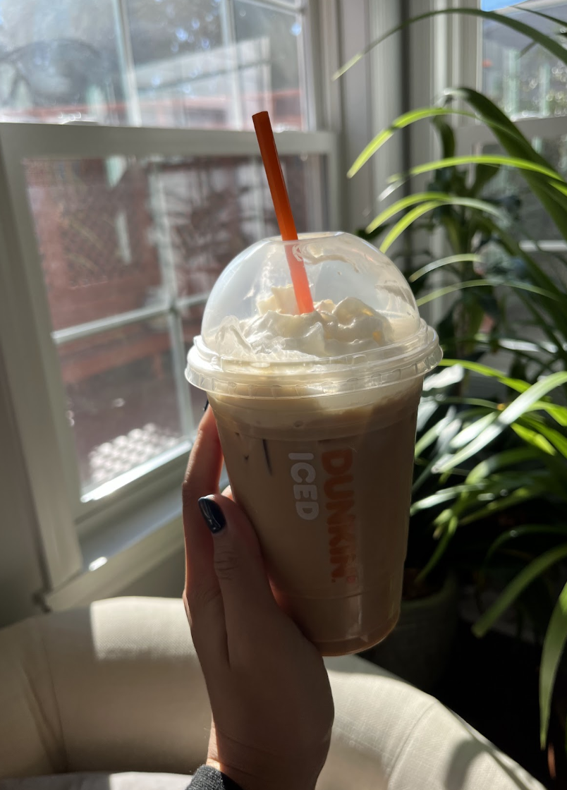 The iced Toasted White Chocolate Signature Latte from Dunkin blends together flavors from sweet chocolate and nutty coffee. 
