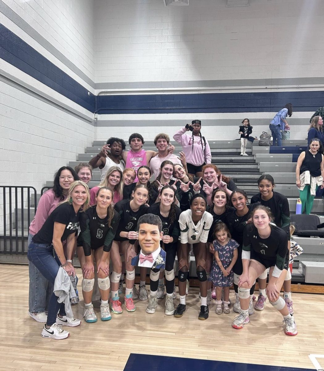 The Green Hope volleyball team poses for a picture after a successful 3-0 win against Millbrook High School, advancing them into the Sweet Sixteen. Photo used with permission from @greenhopevb Via Instagram.