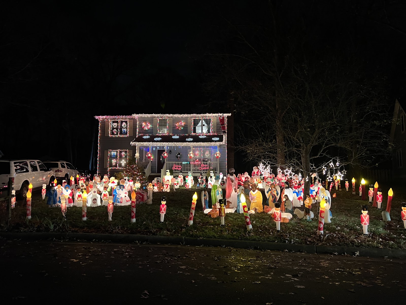 Located off of NW Maynard Road , this house boasts inflatables on the ground as well as lights and wreaths on the house.