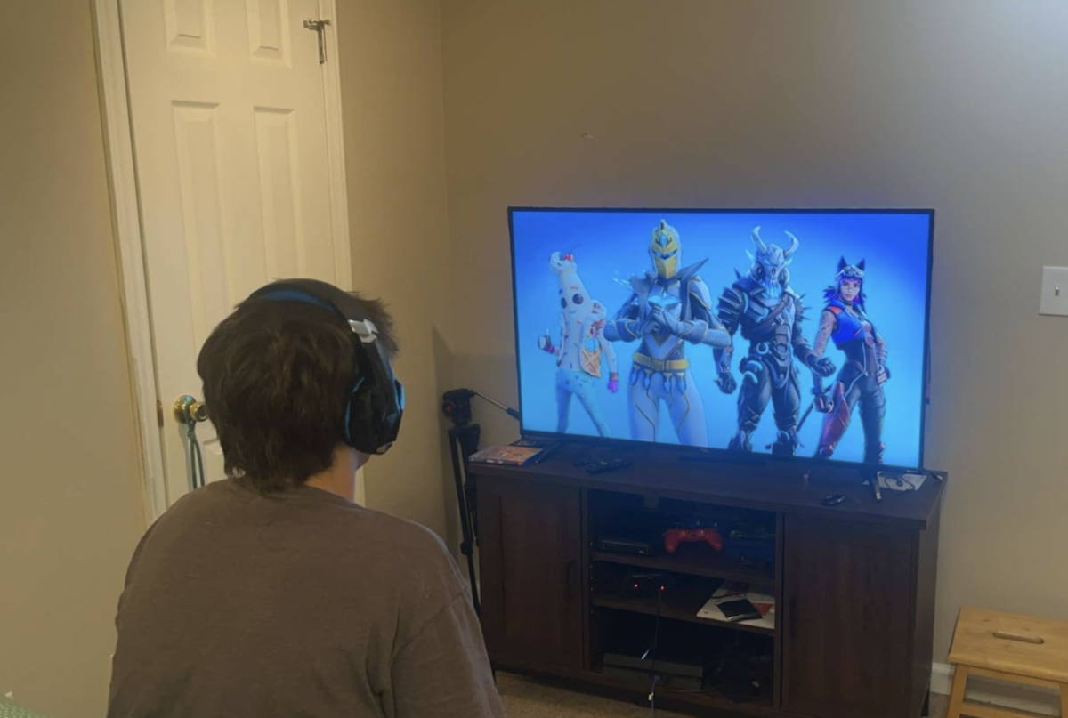 Carter Emanuelson (‘26) loves to join online voice chats with his friends while playing Fortnite, which requires him to put on his gaming headset. Photo used with permission from MG Emanuelson (24). 