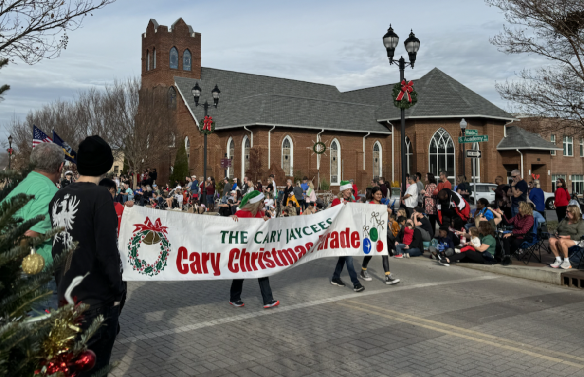 Jaycees Cary Christmas Parade organized the entire parade and began the march with a banner.