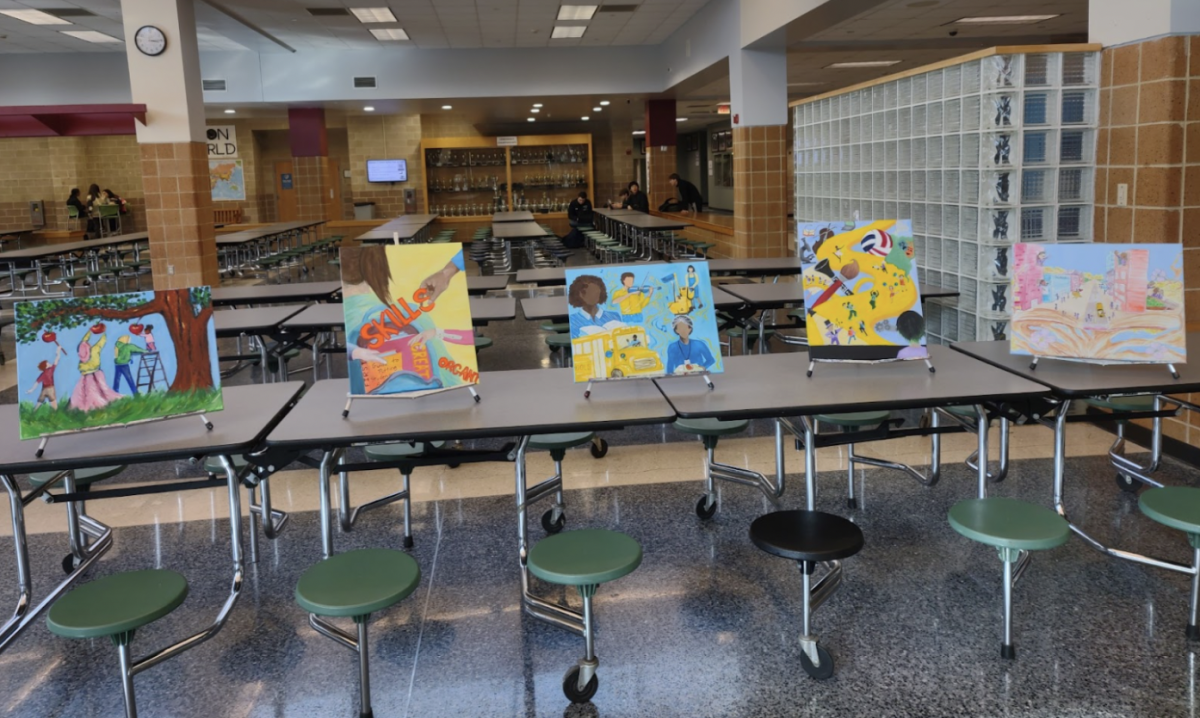 The National Art Honor Societys paintings reflect the core values of education at Superintendent Taylors celebration. Photo used with permission from Mrs. Melissa Poppe. 