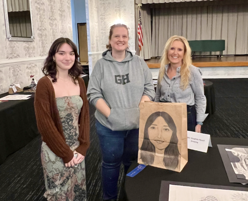 Lily Hightower (25), Mrs. Melissa Poppe, and Mrs. Andera Croom celebrate a win in the graphite art category. Photo used with permission from Lily Hightower (25).