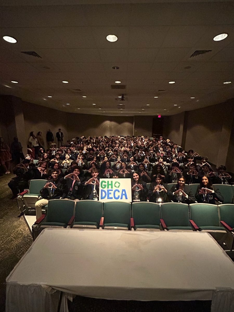 The entire Green Hope DECA chapter debriefs the weekend and prepares for their grand award ceremony in an auditorium. Photo used with permission from Mr. Harrison Ray.