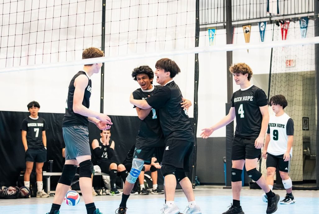 Changbo Lu (‘25) (right center) and Mithu Raghu (‘26) (left center) seen during an intense game at the Triangle Volleyball club. Photo used with permission from Jay Kalidindi (25).