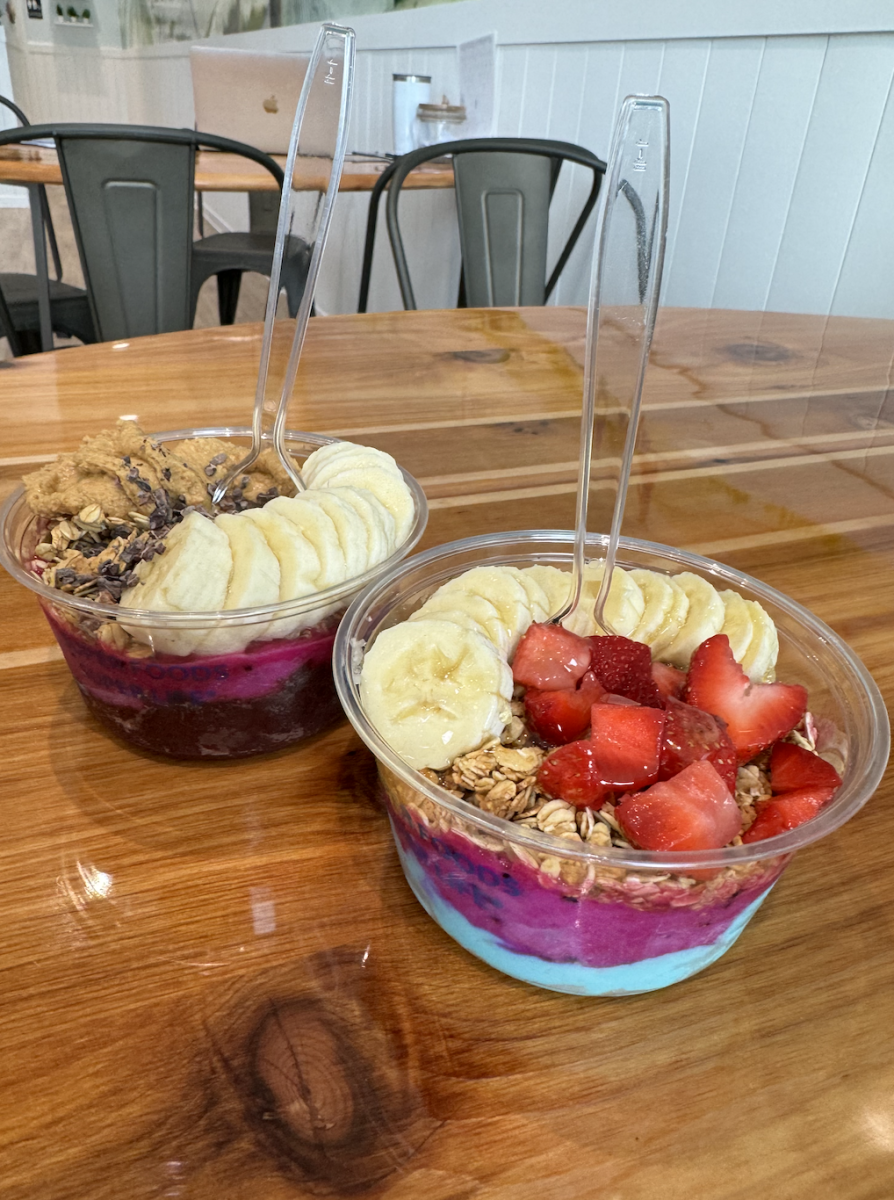 Smoothie bowls from Nautical Bowl: the Nauti Bowl contains acaí, pitaya, freshly ground peanut butter, crunchy granola, and cacao nibs. The Sunrise Bowl contains blue majik, pitaya, granola, bananas, strawberries and honey. 