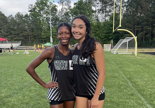 Corinne Isaacs (25) and Ivana Gomez (25) after finishing the 200m dash, placing first and third. Picture used with permission from Coach Julie Ross.
