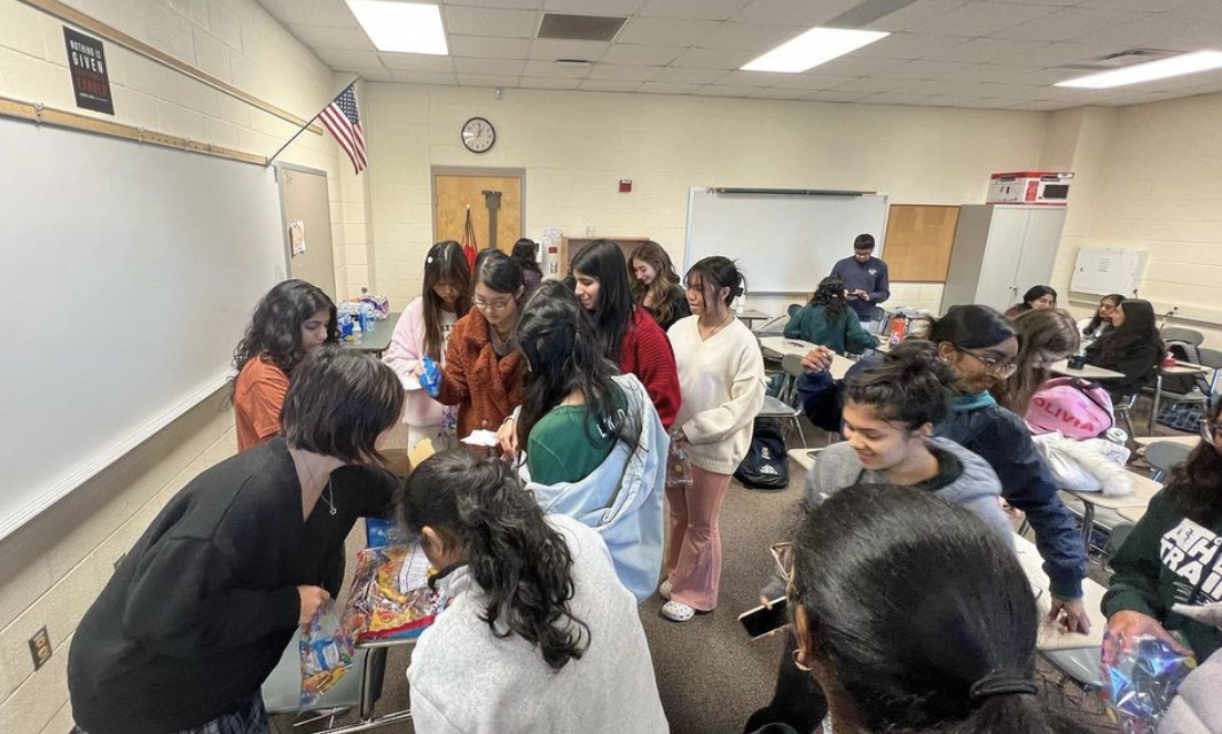 Members of the Green Hope Psi Alpha Honor Society create care packages for students and staff to enjoy. 