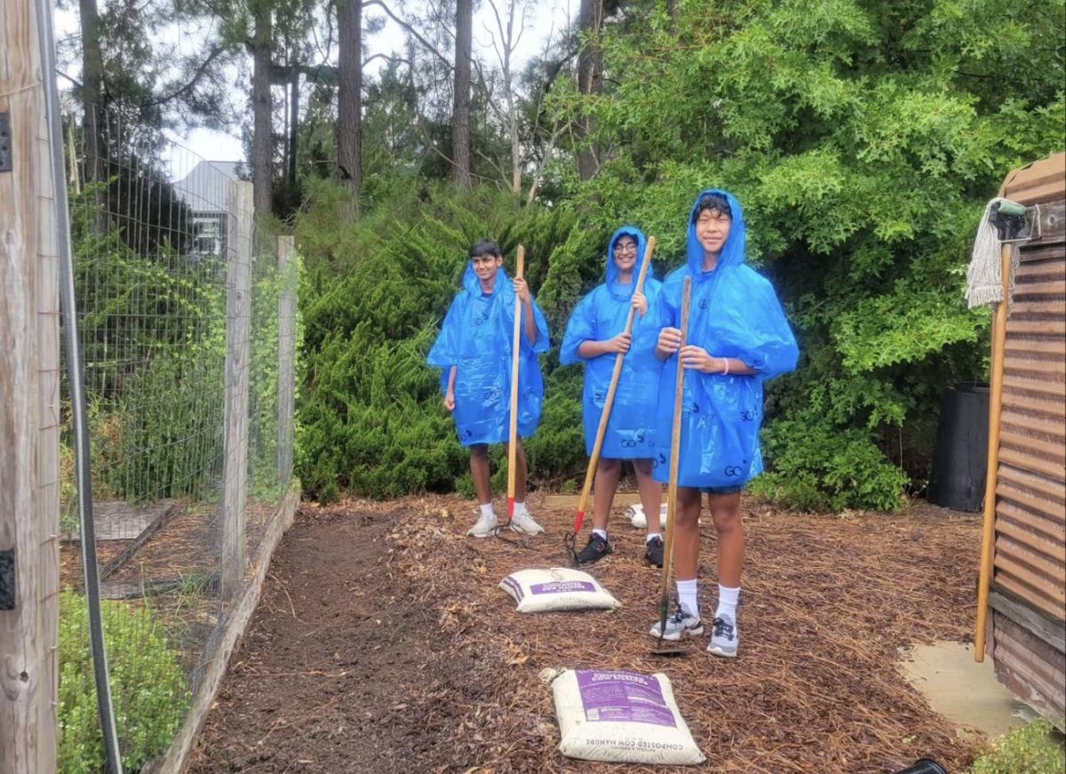 Caleb Kim (‘25) - located on the right - and his fellow club members planted seeds as a part of their volunteering. Photo used with permission from Caleb Kim
