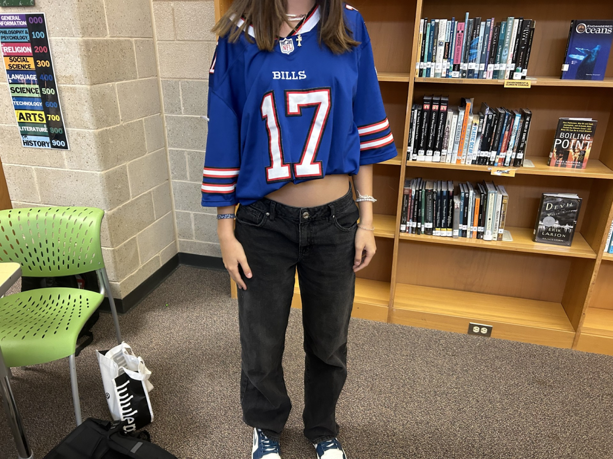 With an oversized jersey and loose jeans, this student opted for a casual 90’s-inspired look for decades day, the theme of the first day of spirit week.
