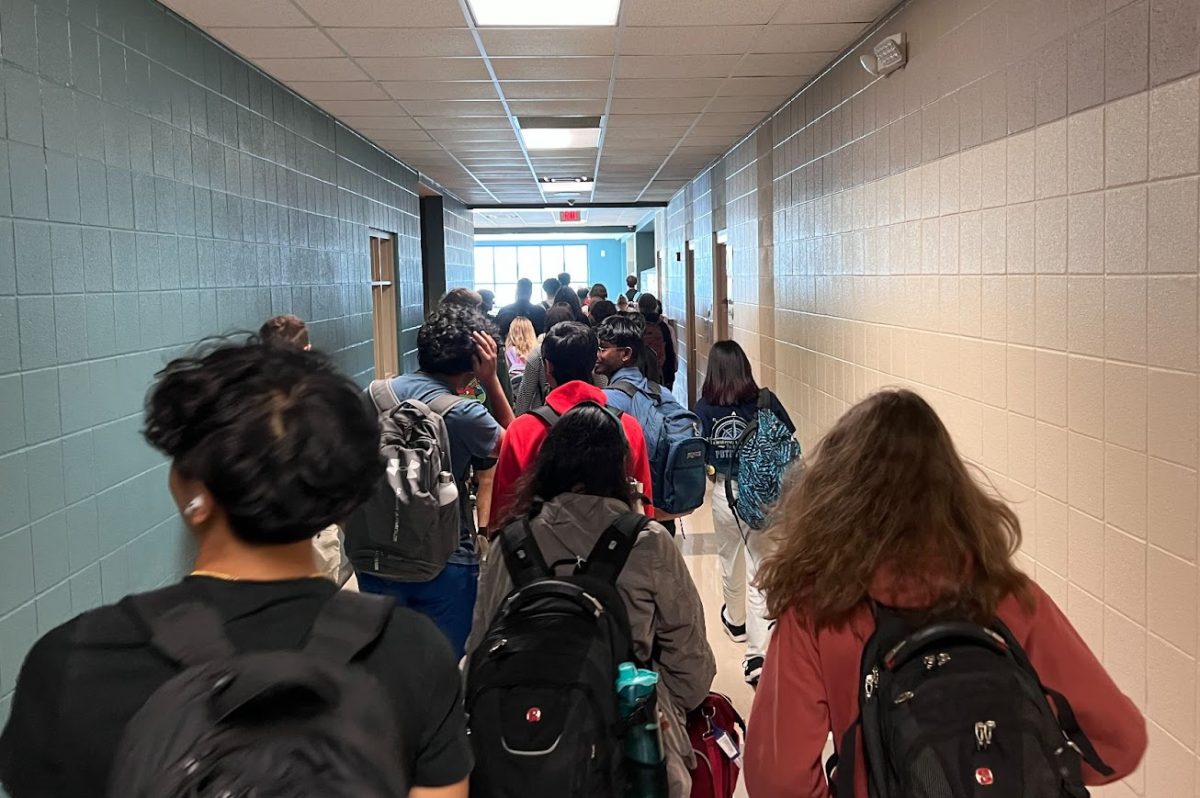 As students walk from class to class, hallways are flooded with hundreds of people.
