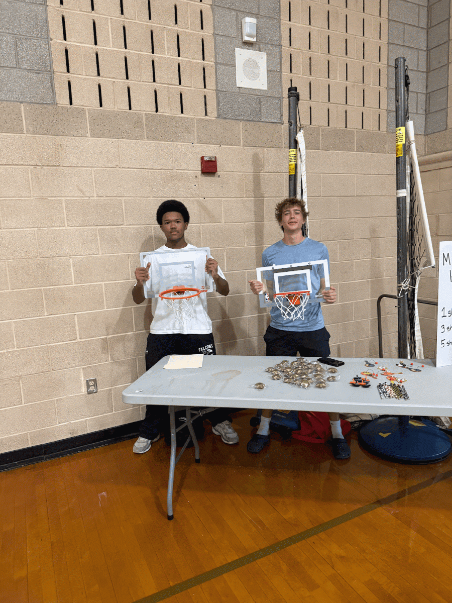 Green Hope business fair participants provided candy if a basketball shot is made.