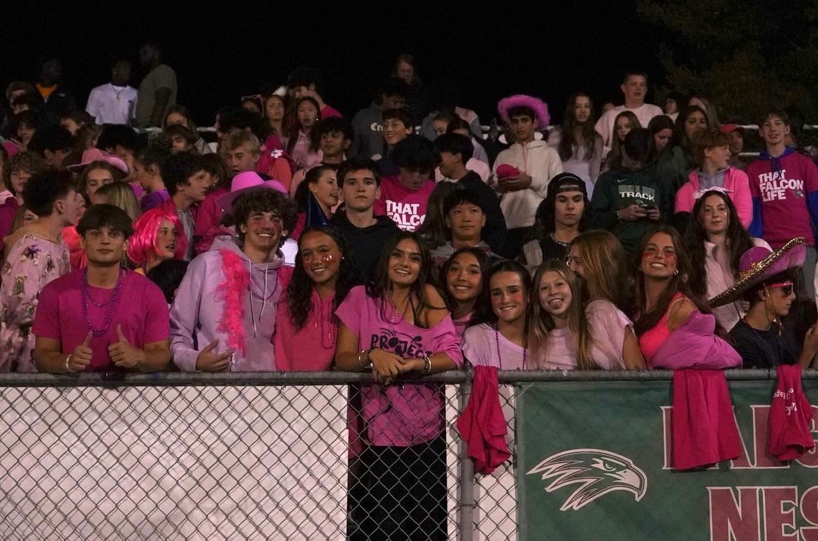 The Green Hope student section dressed in pink for breast cancer awareness at the last home game of the season.