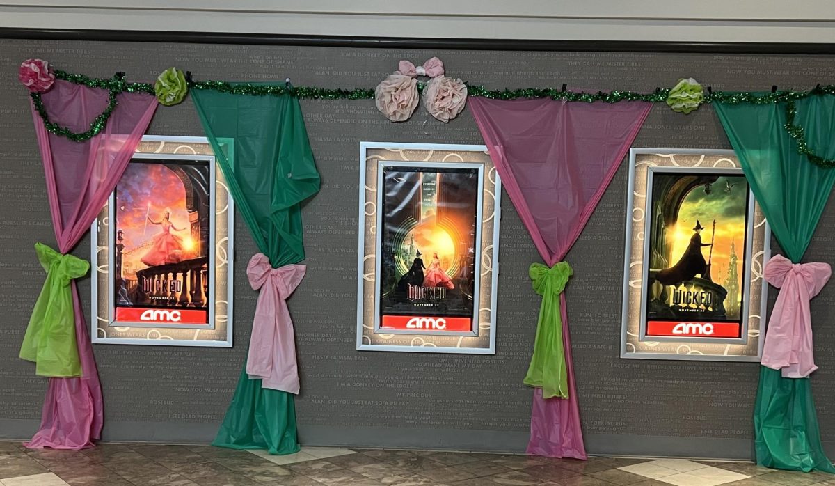 Local movie theaters are getting ready for the “Wicked” crowd, decorating the walls and posters with themed colors for all to see.