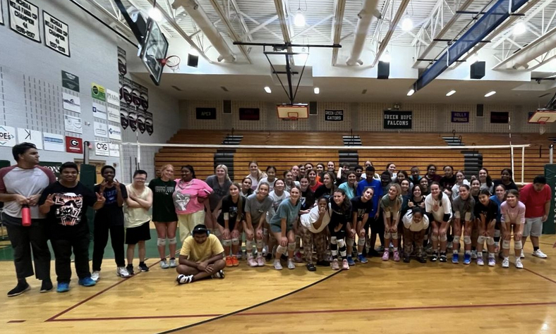 The Varsity Volleyball team shares their practice with the PEPI students. Photo used with permission from @greenhopevb via Instagram.
