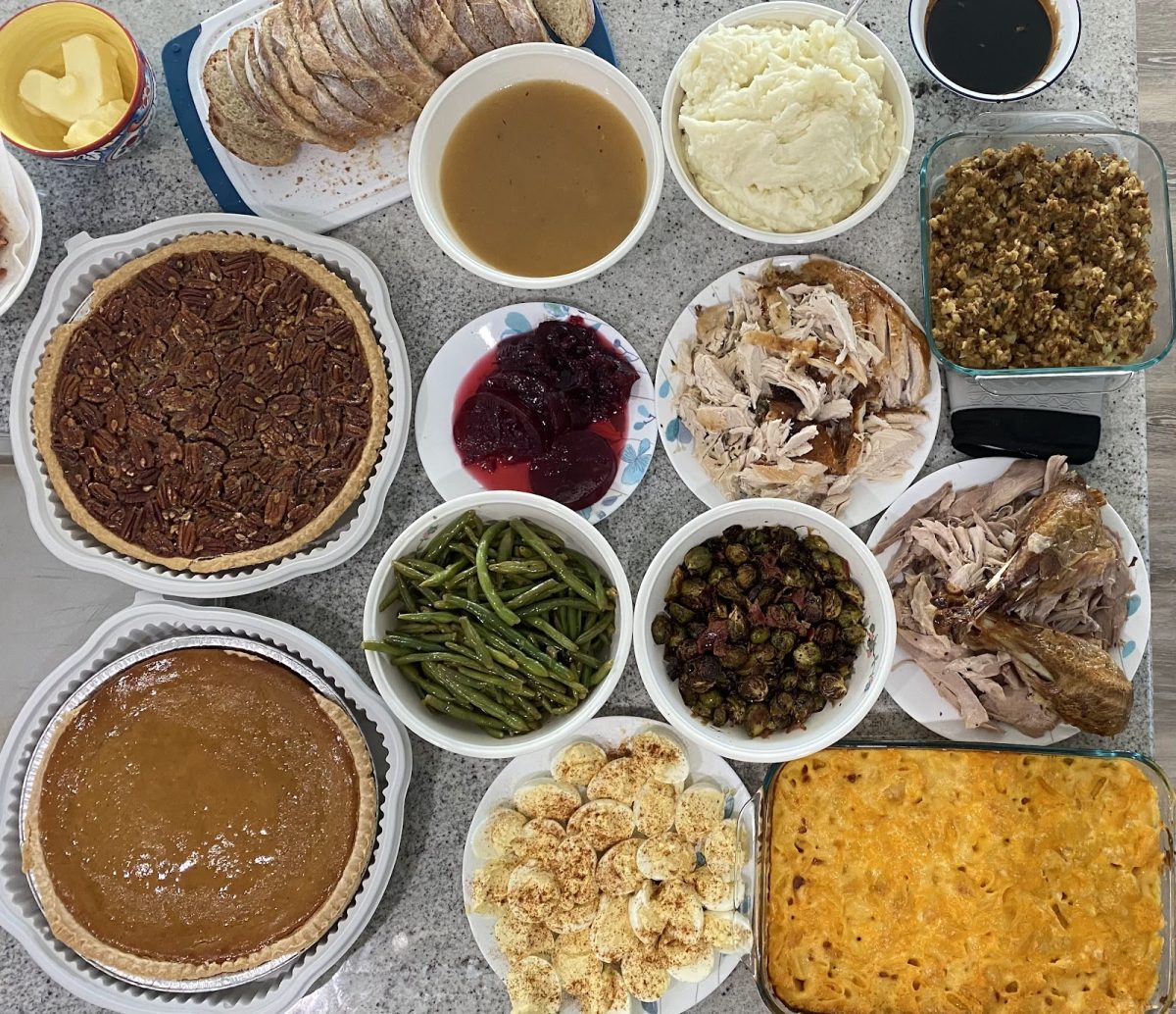 A Thanksgiving feast of turkey, pie, veggies and more traditional Thanksgiving foods.