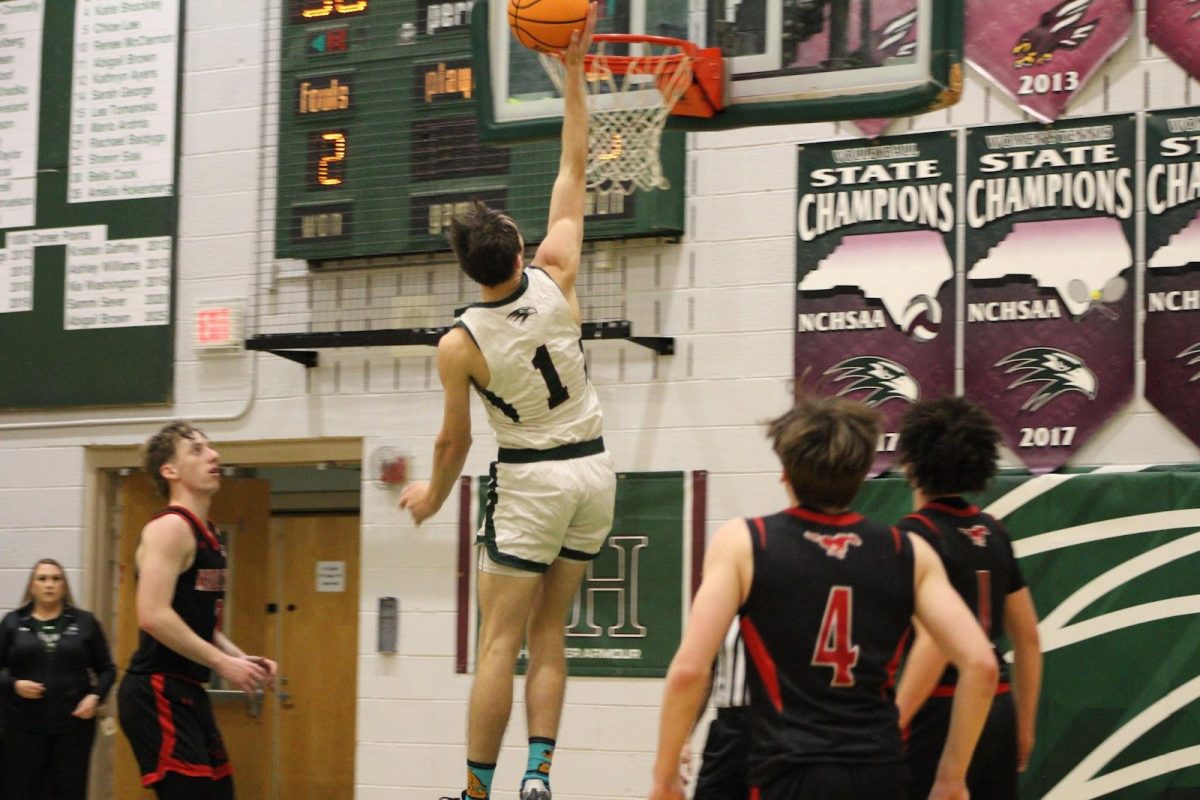 Kody Frey ('25) finishes at the basket. He is currently second in the conference with 18.3 points per game.