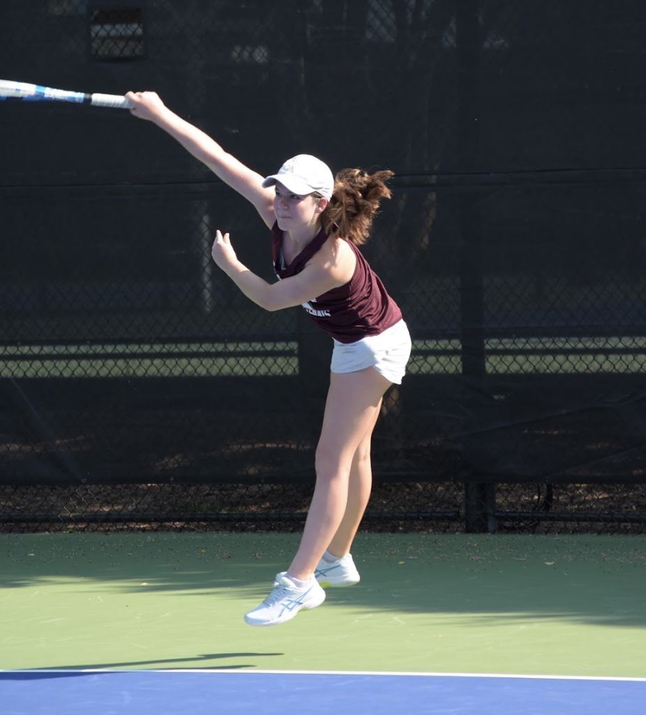 Josselyn DeSantis ('28) hits a serve at a home match, taking place at Cary Tennis Park. Photo used with permission from Josselyn DeSantis. 