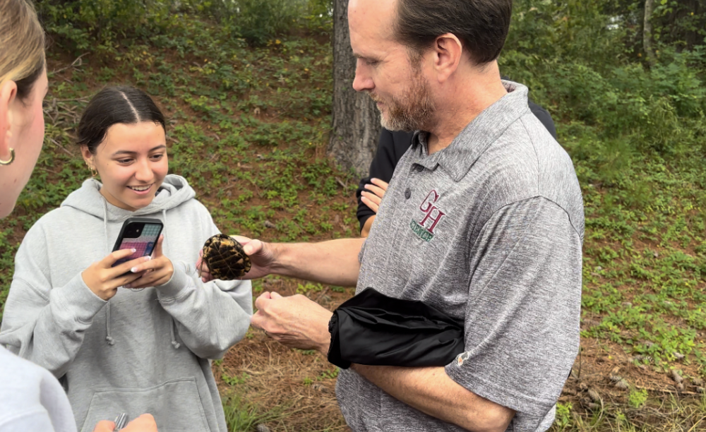 Mr. Benjamin Rush shows AP Environmental Science (APES) students animals on trips to the wetland. 