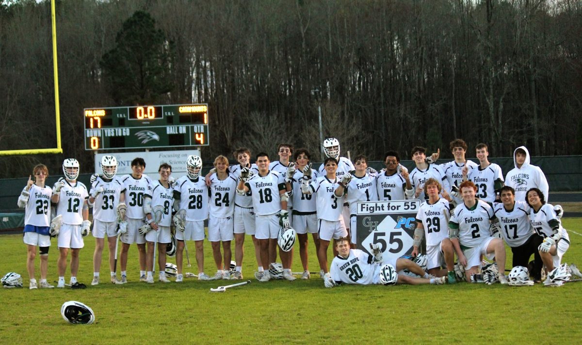 The team poses together after a victory over conference rivals Panther Creek. Photo used with permission from Anne Easter.