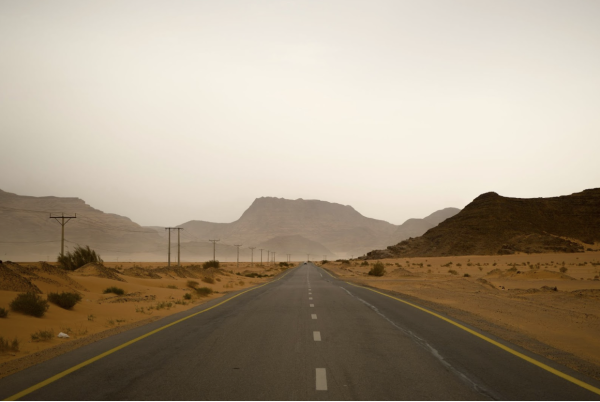 Photo of a highway desert similar looking to the highway in Carpenter’s ‘Man Child’ music video by Adam Hornyak on Unsplash.