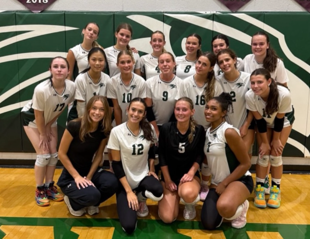 The Green Hope team stands in unity after a 3-0 win against Leesville road earlier in the season.
