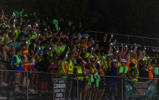 Green Hope’s student section was bright with neon lights at Friday’s game vs Apex Friendship. (photo used with permission from Josh Min)

