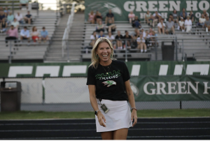 Ms. Cleveland smiling at a Green Hope sporting event. 