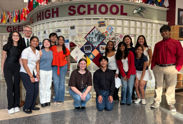Students pose in the commons after presenting their work from the Asian American Oral History Project.

