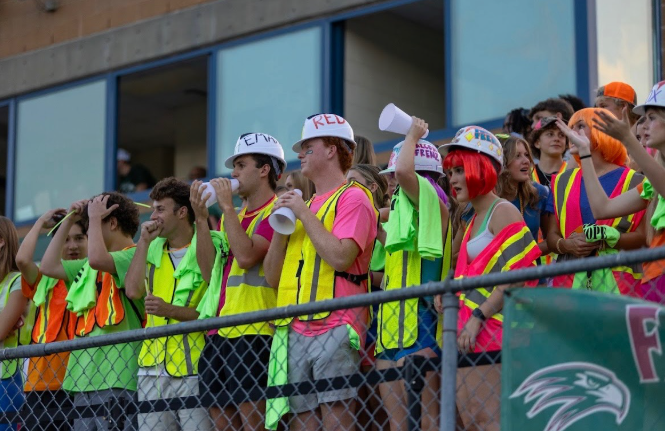 Students watch the game intently, waiting for an opportunity to cheer the team on. 