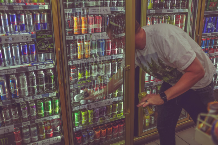 Stores, such as the one in the photo, often have a variety of energy drinks available conveniently for shoppers. Photo from Unsplash by Kenny Eliason.