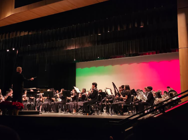 The wind ensemble plays one of their many  concert pieces on the stage of the Green Hope auditorium. Photo used with permission from Monica Perez.