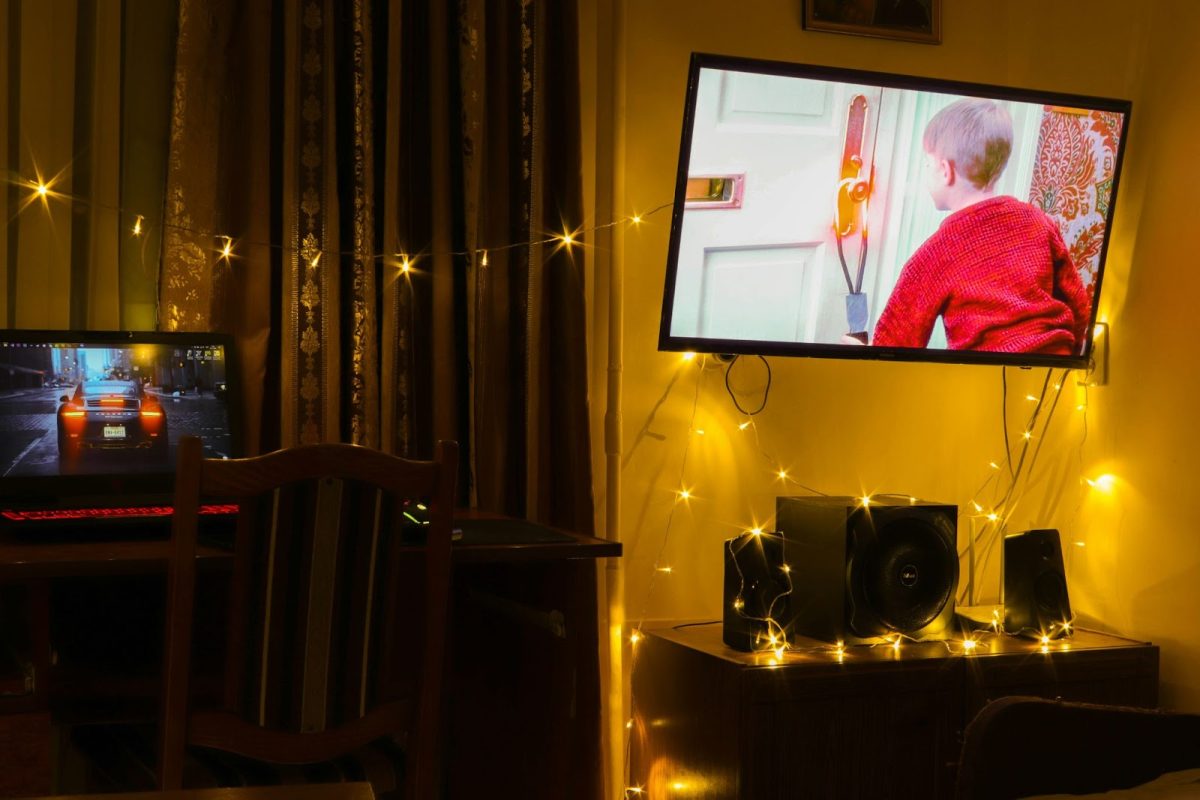 The classic Christmas movie "Home Alone" plays in a dimly lit room. Many argue that the film is the best holiday movie. Photo used with permission from Liubomyr Vovchak via Unsplash