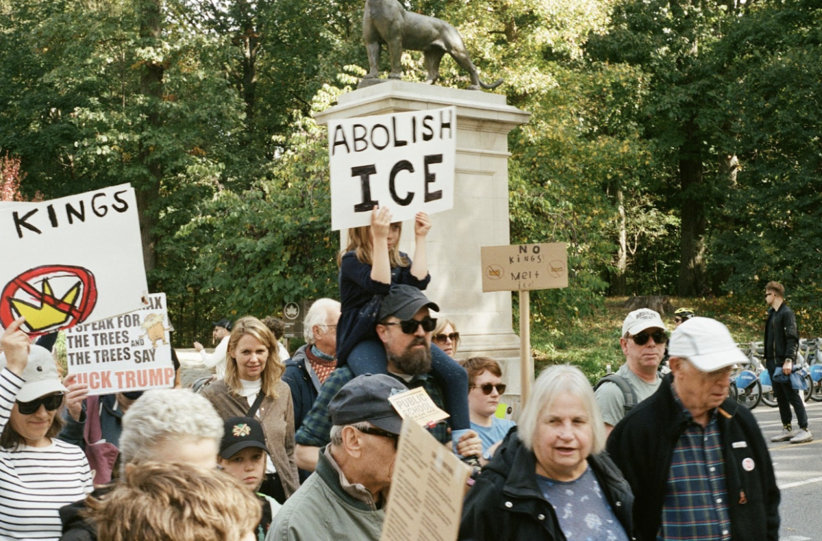 Photo from a No King’s protest back in October that features signs against ICE, taken by Bradley Andrews on Unsplash.