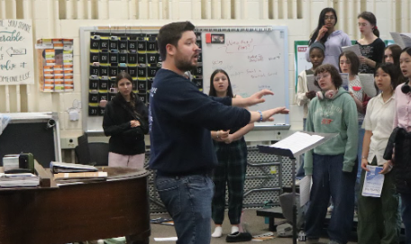 Bringing students from all corners of Green Hope together, Mr. Botwick leads his chorus through a song. Photo used with permission from McKenna Cassell.
